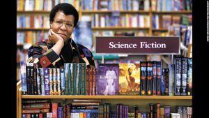 Science Fiction writer Octavia Butler poses for a photograph near some of her novels at University Book Store in Seattle, Wash., on Feb. 4, 2004. Butler, considered the first black woman to gain national prominence as a science fiction writer, died Friday, Feb. 24, 2006, after falling and striking her head on the cobbled walkway outside her Seattle home, a close friend said. She was 58. (AP Photo/ Seattle Post-Intelligencer, Joshua Trujillo)